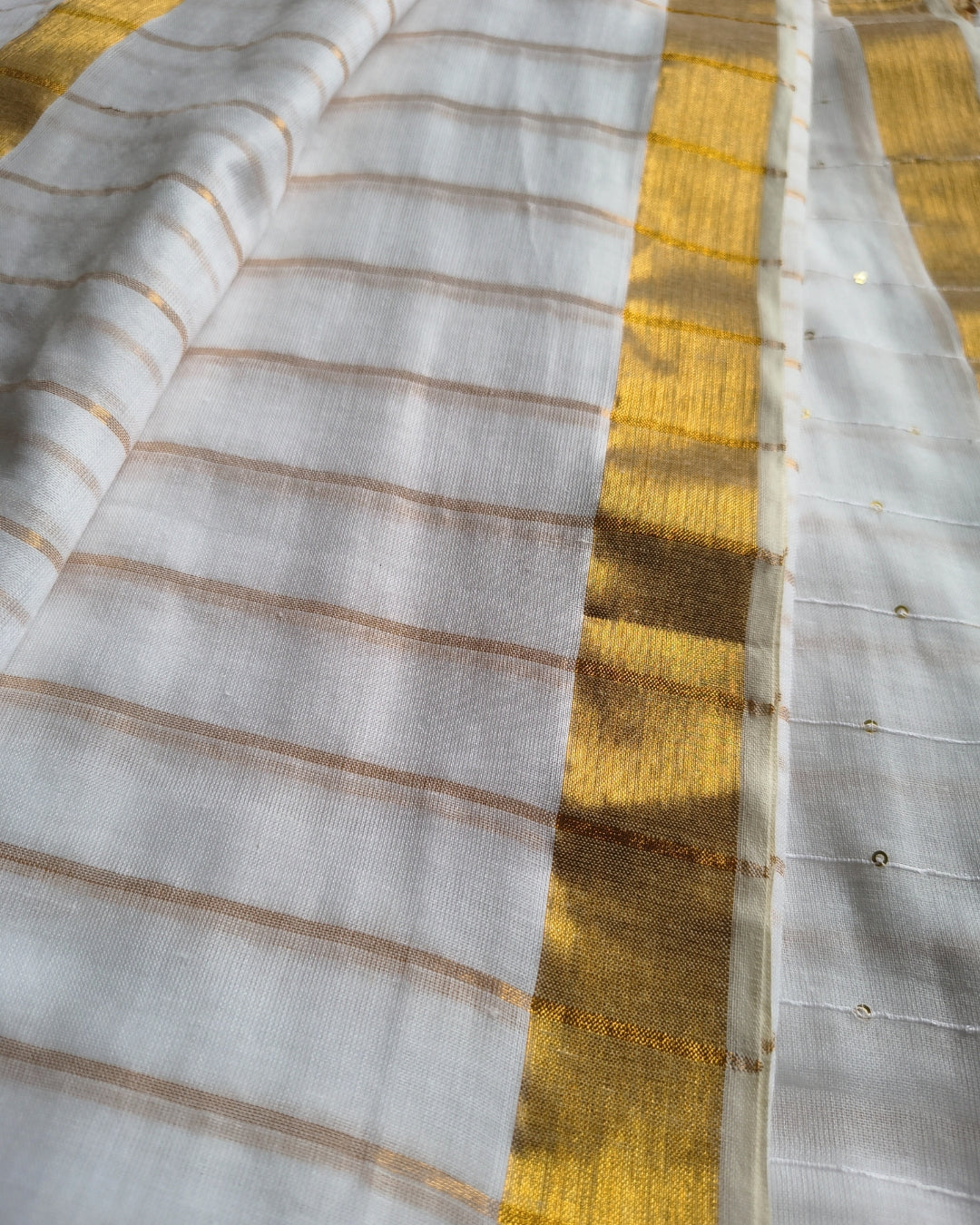 Handloom Mul Cotton Saree with Golden Stripes, Border and Sequence in Pallu - White